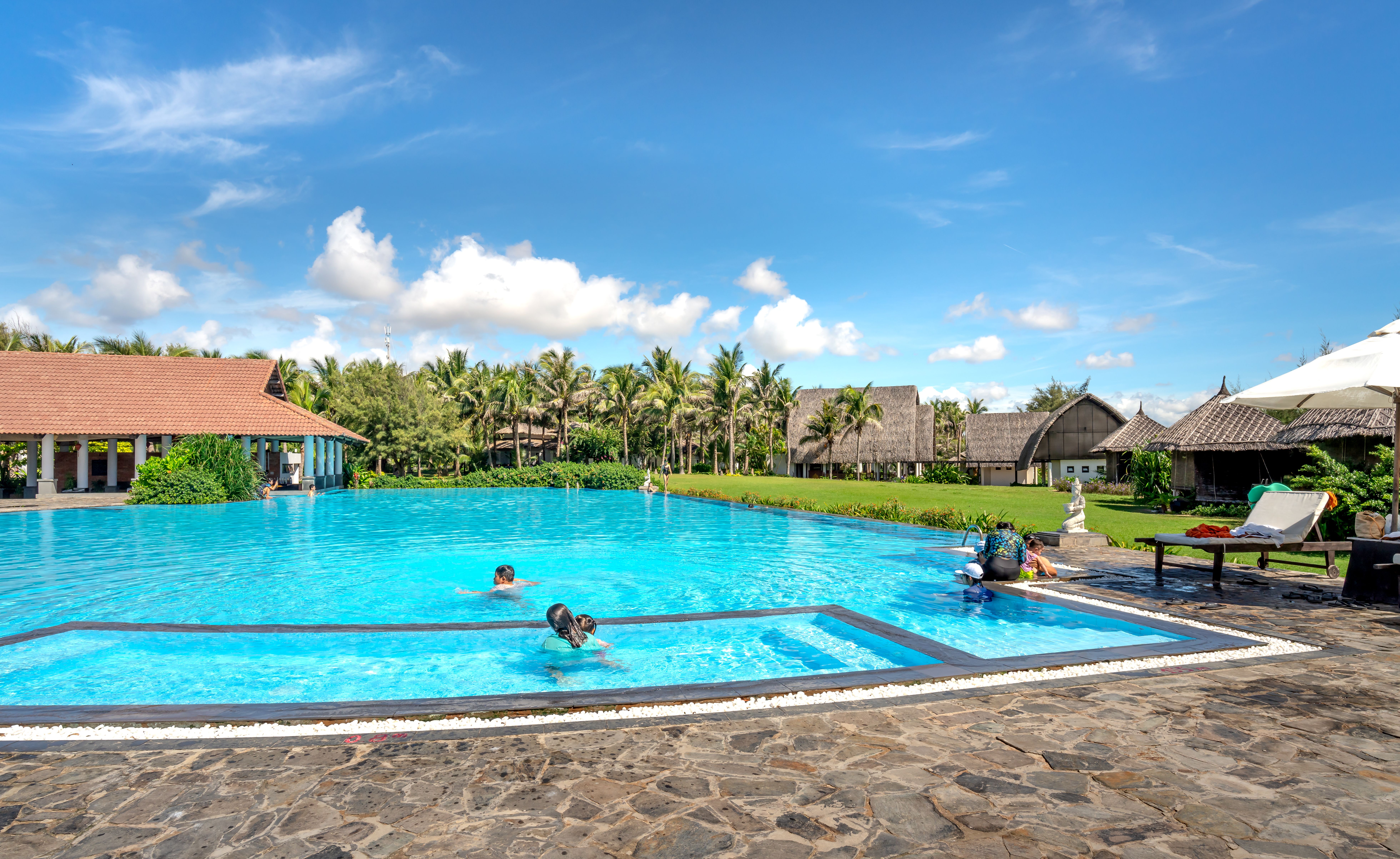 Crystal clear swimming pool maintained by Spotless Pool Maintenance